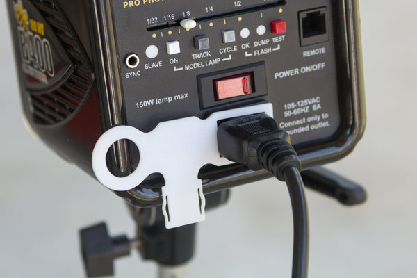 Trigger Tether shown attached to studio strobe